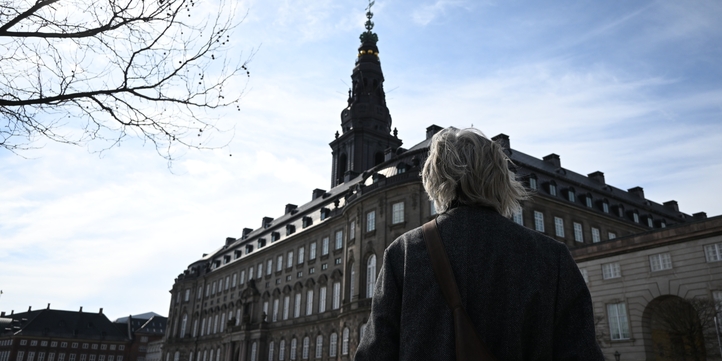 Woman standing in front of Danish Folketinget