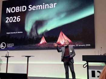 A man standing in front of a screen with the text NOBID Seminar 2026.