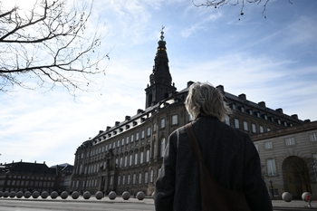 Woman standing in front of Danish Folketinget
